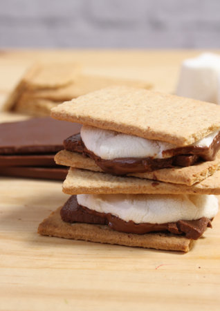 Smores. Marshmallow with Chocolate and Graham Crackers in Rustic Kitchen