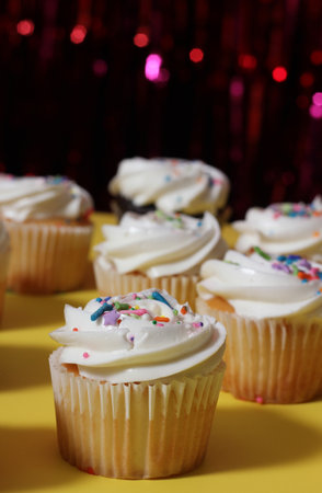 Cupcakes on Table at Party With Bokeh Backgroundの写真素材