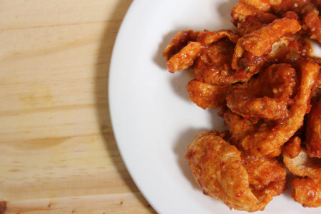 Fried Pork Skins With Red Salsa in Plate on Tableの写真素材