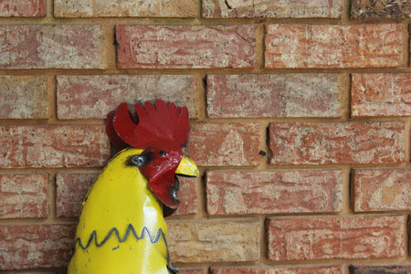 Metal Rooster on Brick Wall. Rural East Texas Sceneryの写真素材