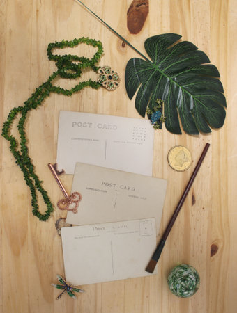 Vintage Blank Postcards With Green Jewelry and Old Coinの写真素材