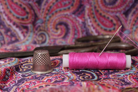 Hot Pink Thread on Vintage Pink and Purple Satin Close up