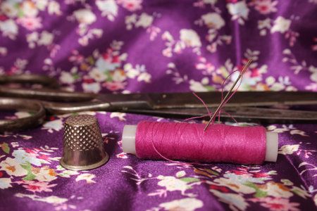 Hot Pink Thread on Vintage Pink and Purple Satinの写真素材