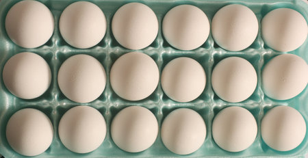 Close up of Fresh White Eggs in Blue Cartonの写真素材