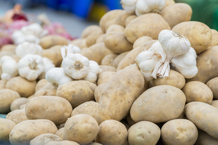 potatoes and garlic sold in the marketの写真素材