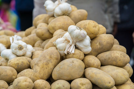 potatoes and garlic sold in the marketの写真素材