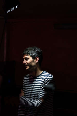 Young man shy with striped t-shirt