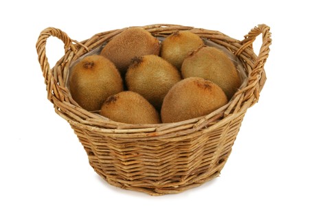 Wicker basket with six kiwis. Isolated on white. path included.の写真素材