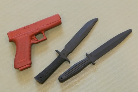 Self defence practice weapons on a typical martial art mat background.の写真素材