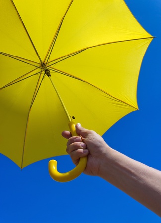 yellow umbrella under blue skyの写真素材