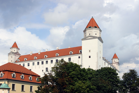 historical white castle of Bratislava, dominating the capital of Slovakia, under a blue cloudy skyのeditorial素材
