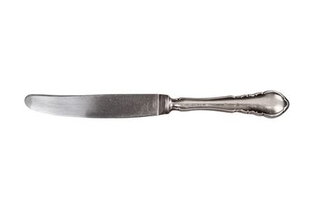 Old antique silver knife isolated on white.の写真素材
