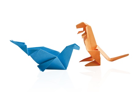 Blue and orange origami dinosaur isolated on white background.の写真素材