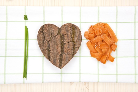 I love pasta made of fresh chive, heart shaped wood and pasta.の写真素材