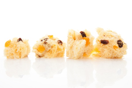 Luxurious panettone pieces isolated on white background. Festive food background.
