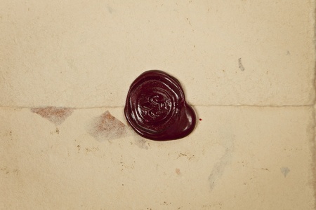 Antique red wax seal on old vintage grunge paper background. Secret, security concept. のeditorial素材