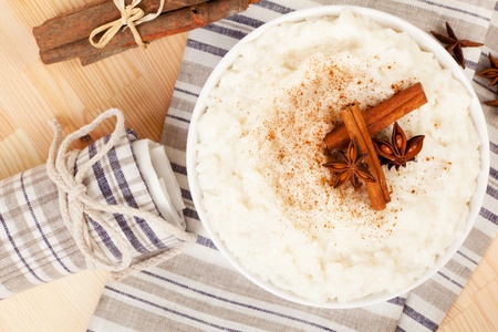 Delicious rice pudding with cinnamon and star anise. Luxurious sweet dessert concept.の写真素材
