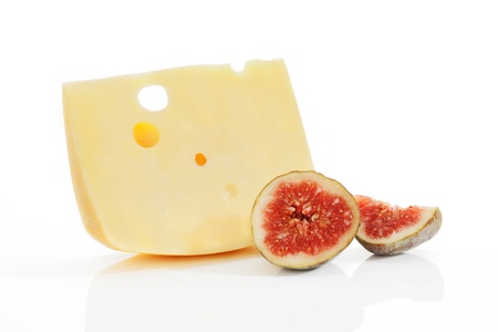 Swiss cheese peace with fig fruit isolated on white background  Culinary gastronomy background の写真素材