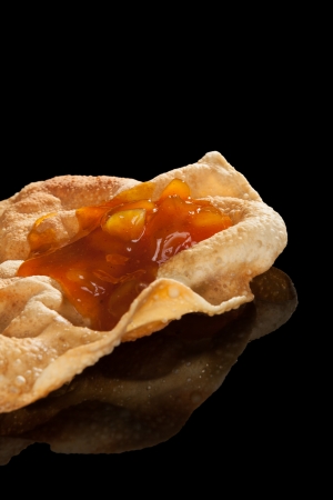 Pappadum with chutney isolated on black background with reflection  Luxurious culinary indian eating concept の写真素材