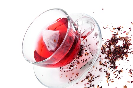 Dried herbal and fruit tea and hot tea with teabag in transparent tea cup isolated on white background  Healthy tea drinking concept の写真素材