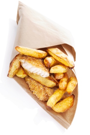 Delicious golden fish and chips in brow bag. Traditional english eating. Unhealthy fast and junk food.の写真素材