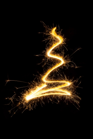 Sparkling abstract christmas tree isolated on black background. Contemporary minimal style christmas card.の写真素材