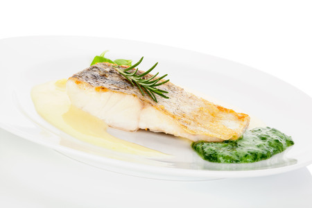 Delicious fish eating. Fresh perch fish fillet with potato and vegetable sauce on white plate...