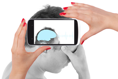 Headache. Young man touching his head and seeing the diagnosis on a smartphone screen. The future of...