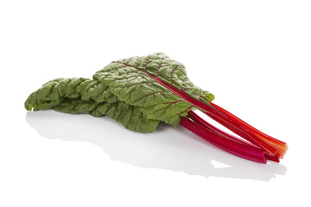 Fresh mangold leaves isolated on white background with reflectionの写真素材