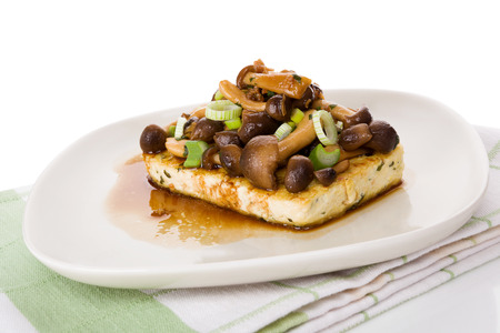 Tofu with shimeji mushrooms, culinary vegetarian and vegan eating.の写真素材