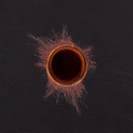 Ayahuasca, traditional shamanic plant medicine. Ground mimosa hostilis root bark and ayahuasca brew, top view.の写真素材