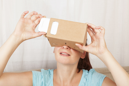 Women using cardboard VR glasses. Virtual reality.の写真素材