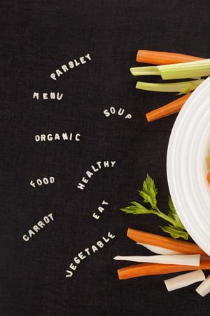 Healthy and fresh vegetable soup with ABC noodles from above.の写真素材