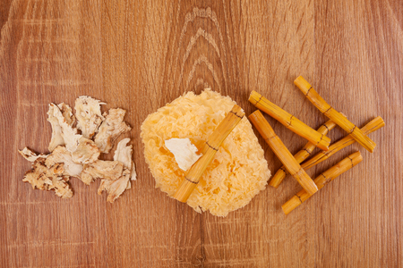 Chinese healing herbs on wooden background. Medicine for high blood pressure. TCM.の写真素材