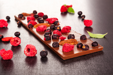 Luxury chocolate bar with healthy freeze-dried berries.の写真素材