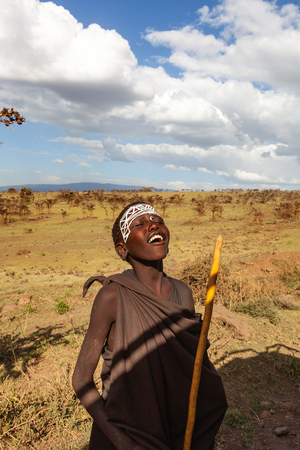 Zanzibar, Tanzania - January 14, 2017. Young maasai boy after ceremony in Serengeti National Park.のeditorial素材