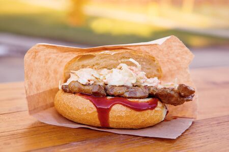 Homemade pork burger with coleslaw and bbq sauce. Takeaway food.