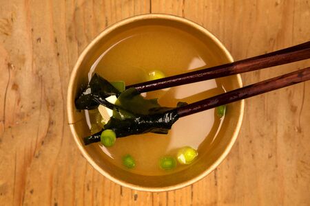 Miso soup in takeaway cup from above. Traditional asian cousine.の写真素材