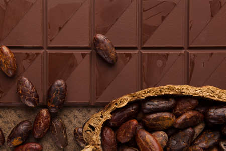 Delicious brown chocolate background. Dark mood picture.