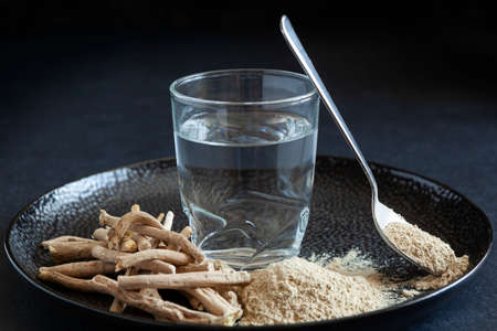 Dry Ashwagandha roots , also known as Withania Somnifera, Indian Ginseng, Poison Gooseberry, or Winter Cherry on dark background. Alterantive medicine.の写真素材