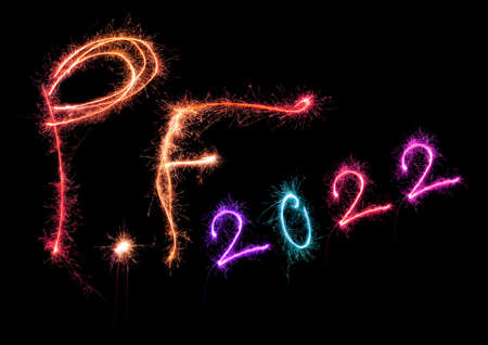 New year greeting card. P.f. pour feliciter 2022 made from sparkling colorful lights isolated on...
