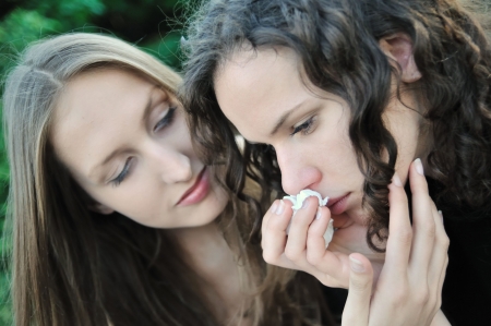 Friends series - detail of two teenage girls, one comforts and regrets anotherの写真素材