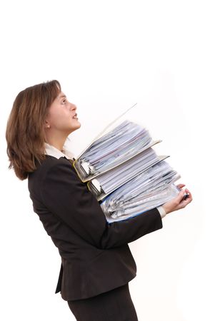 Business woman overloaded with heavy files isolated on white backgroundの写真素材