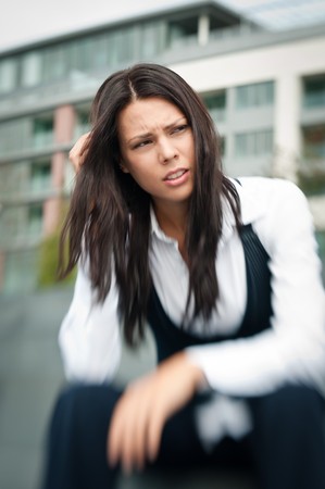 Troubles - worried business womanの写真素材