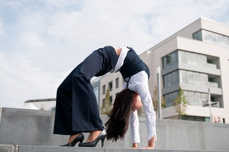 Flexibility - business woman outdoorsの写真素材