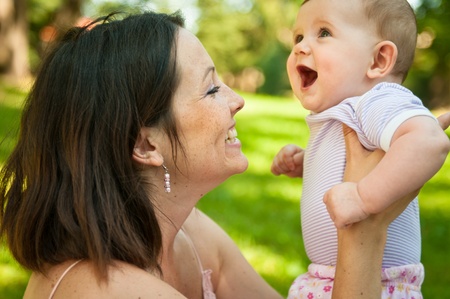 Happy mother with her smiling babyの写真素材