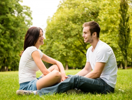 Young couple talking outdoorの写真素材