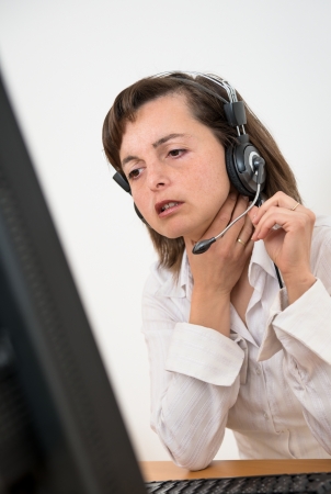 Sick business person at computerの写真素材