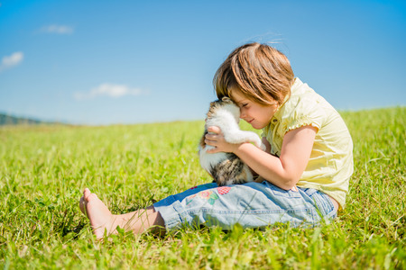 Child with kittenの写真素材
