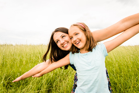 Mother and child flyingの写真素材